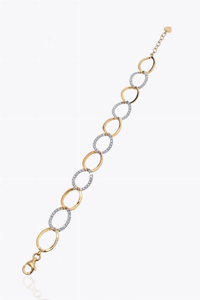 BRACCIALE : Peso gr 8 2 Lunghezza cm 18 in oro rosa con anelli ovalizzati lisci alternati ad anelli in diamanti taglio brillante per totali ct 0 97 ca  probabile colore G-H  purezza IF-VVS  - Asta Asta 205 Gioielli - Associazione Nazionale - Case d'Asta italiane