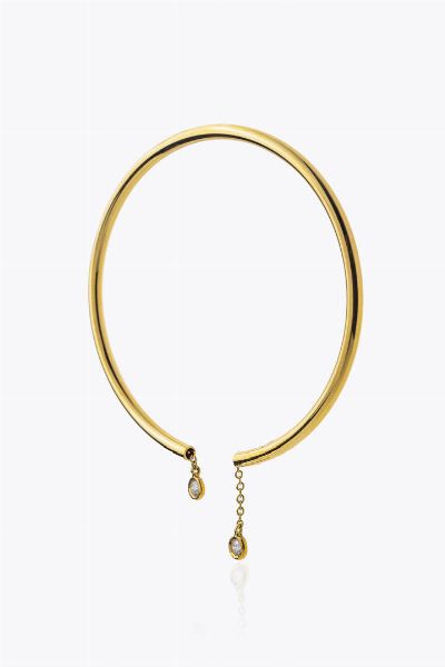 BRACCIALE : Peso gr 6 0 rigido  in oro giallo  con terminali recanti due diamanti tremblant per totali ct 0 12 ca  - Asta Asta 205 Gioielli - Associazione Nazionale - Case d'Asta italiane