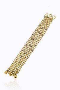 CARTIER - Peso gr 56 5 Lunghezza cm 19 Bracciale in oro giallo  firmato Cartier  modello Draperie  composto da dieci fili  [..]