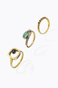 LOTTO DI TRE ANELLI - -in oro giallo  sommit� con cinque piccoli rubini taglio rotondo per totali ct 0 20 ca. Peso gr 1 8. Misura 13  [..]