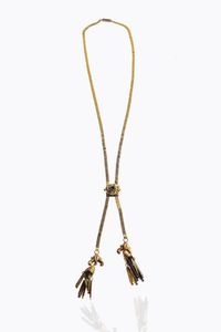 SALISCENDI - Peso gr 9 4 in oro giallo a bassa caratura con maglia geometrica; al centro elemento ovale con pietra verde e  [..]