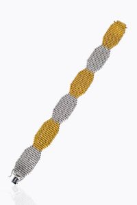 BRACCIALE - Peso gr 61 1 Lunghezza cm 19 in oro giallo e bianco a maglia geometrica satinata