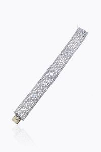 BRACCIALE - Peso gr 49 2 Lunghezza cm 18 in oro bianco  anni '20  interamente lavorato a motivo di greca  con al centro quattro  [..]