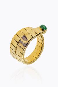 BRACCIALE - Peso gr 70 9 semirigido in oro giallo  a forma di serpente  composto da segmenti lucidi  terminanti con   smeraldo  [..]