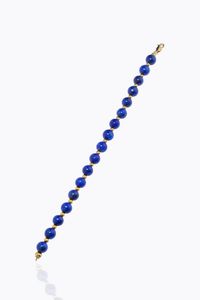 BRACCIALE - Lunghezza cm 19 composto da un filo di sfere di lapislazzuli del diam di mm 8. Chiusura e distanziali in oro g [..]