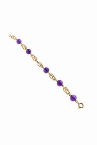 BRACCIALE - Peso gr 7 8 Lunghezza cm 16 5 composto da segmenti cilindrici intrecciati e satinati  alternati a sfere in ametiste  [..]
