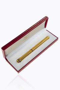 CARTIER - Stilografica Must de Cartier  corpo fesonato e dorato. Corredata di scatola
