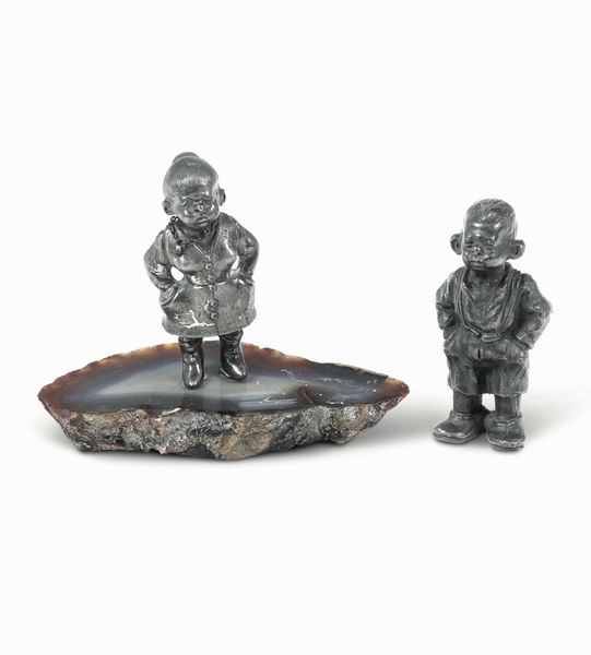 Due figure caricaturali di cui una in argento con base in pietra dura. Argenteria milanese del XX secolo. Argentiere Eredi Mazzetti  - Asta Argenti del XX secolo - Associazione Nazionale - Case d'Asta italiane