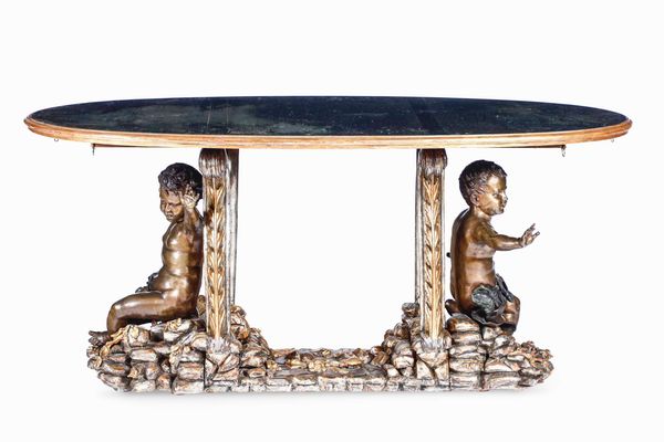 Tavolo in legno intagliato, dorato con putti in bronzo patinato. XX secolo  - Asta Dimore italiane  - Associazione Nazionale - Case d'Asta italiane