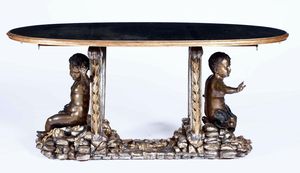Tavolo in legno intagliato, dorato con putti in bronzo patinato. XX secolo  - Asta Dimore italiane  - Associazione Nazionale - Case d'Asta italiane