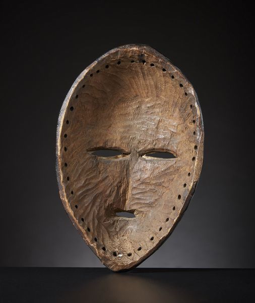 Dan - Costa d'Avorio/Liberia : Maschera Dan.Legno duro a patina lucida, pigmento nero e metallo.Segni d'uso.  - Asta Asta 365 | ARTE AFRICANA, OCEANICA E DELLE AMERICHE - ARTE AFRICANA Tradizionale - Associazione Nazionale - Case d'Asta italiane