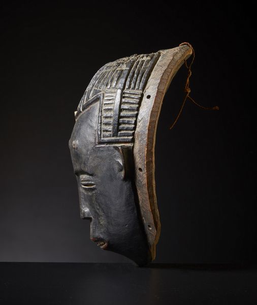 Guro - Costa d'Avorio : Maschera Gugu.Legno duro a patina scura.Difetti, mancanze e notevoli segni d'uso.  - Asta Asta 365 | ARTE AFRICANA, OCEANICA E DELLE AMERICHE - ARTE AFRICANA Tradizionale - Associazione Nazionale - Case d'Asta italiane