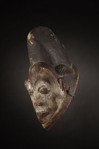 Punu - Gabon, Regione del fiume Ngouni : Maschera Mukudj.Legno tenero a patina naturale, caolino e pigmenti.Mancanze e segni d'uso.  - Asta Asta 365 | ARTE AFRICANA, OCEANICA E DELLE AMERICHE - ARTE AFRICANA Tradizionale - Associazione Nazionale - Case d'Asta italiane