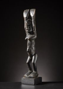 Dogon o Tellem - Mali - Figura Nommo con braccia alzate.Legno duro a patina scura.Difetti e segni d'uso.