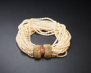 . - Bracciale '' liberty'' con perline oro 14 carati e piccoli rubini.
