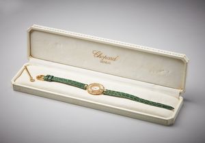 CHOPARD - Orologio da donna in oro giallo 750/1000  modello Happy Diamonds  con diamanti e smeraldi di eccezionale qualit e purezza.