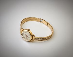 . - Orologio da donna con cassa di forma tonda con cinturino in oro giallo 750/1000.
