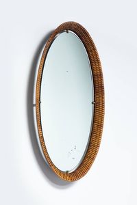 PRODUZIONE ITALIANA - Specchio con cornice in vimini e particolari in ottone. Anni '50 cm 90x47