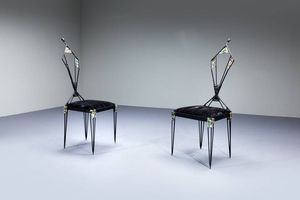 UGO TREVISAN - Coppia di sedie in ferro con decori a smalto.