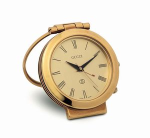 GUCCI - GUCCI, piccolo orologio da scrivania, in ottone dorato e smalto. Realizzato nel 1980 circa. Accompagnato dalla scatola originale e Garanzia
