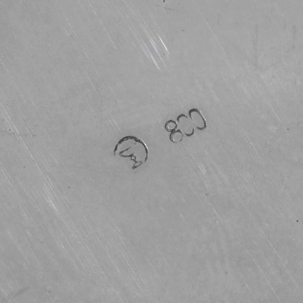 Cestino. Argento fuso e sagomato, manico ad arco in legno ebanizzato. Argenteria artistica italiana del XX secolo  - Asta Argenti - Associazione Nazionale - Case d'Asta italiane