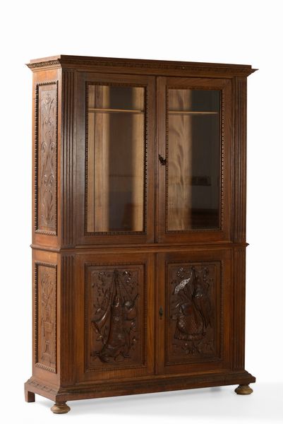 Mobile porta fucili in legno intagliato a doppio corpo in stile rinascimento  - Asta Antiquariato Settembre - Associazione Nazionale - Case d'Asta italiane