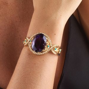 BRACCIALE RIGIDO CON GRANDE AMETISTA TURCHESI E PERLE  - Asta Gioielli  - Associazione Nazionale - Case d'Asta italiane