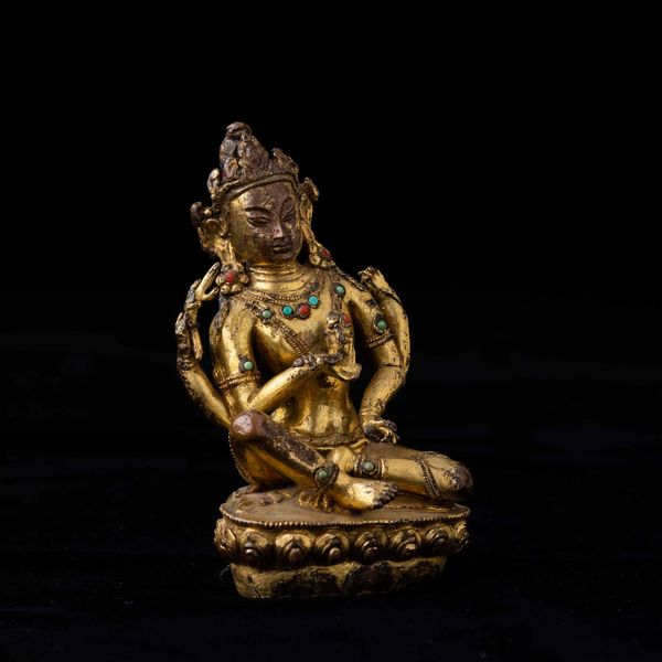 Figura di Avalokitesvara seduta su fiore di loto in bronzo dorato con tracce di policromia e innesti di pietre dure, Tibet, XV-XVI secolo  - Asta Fine chinese works of art - Associazione Nazionale - Case d'Asta italiane