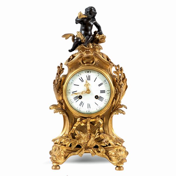 Orologio da tavolo in bronzo dorato e brunito  - Asta Da Importanti Collezioni Romane - Associazione Nazionale - Case d'Asta italiane