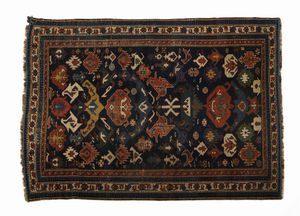 CAUCASO, XIX SECOLO - Tappeto shirvan Bidjov, campo blu con decori geometrici