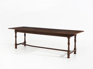 MANIFATTURA CENTROITALIANA DEL XVIII SECOLO - Grande tavolo fratino in legno di noce, gambe a rocchetto unite da traverse