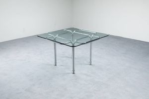 GUIDO FALESCHINI - Tavolo con struttura in metallo cromato  piano in vetro. Prod. Acerbis anni '70 cm 72 5x114x114