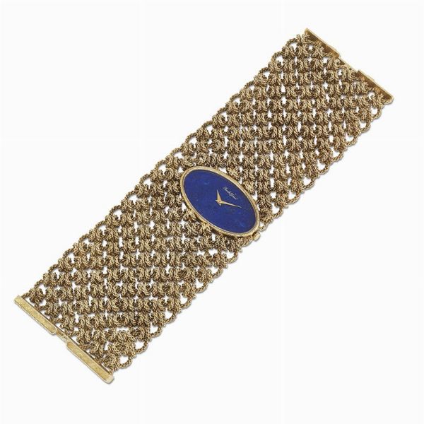 GRANDE BRACCIALE AD AMPIA FASCIA CON OROLOGIO  - Asta Gioielli - Associazione Nazionale - Case d'Asta italiane