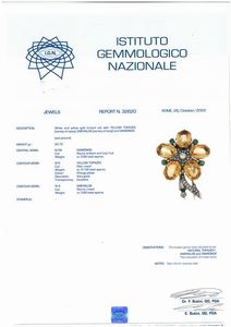 SPILLA A FORMA DI FIORE CON TOPAZI GIALLI SMERALDI E DIAMANTI  - Asta Gioielli - Associazione Nazionale - Case d'Asta italiane