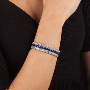 BRACCIALE A FASCIA CON ZAFFIRI SINTETICI E DIAMANTI  - Asta Gioielli - Associazione Nazionale - Case d'Asta italiane