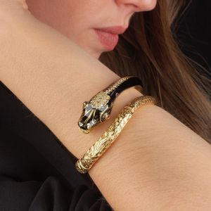 BRACCIALE SEMIRIGIDO A SERPE CON RUBINI E DIAMANTI  - Asta Gioielli - Associazione Nazionale - Case d'Asta italiane