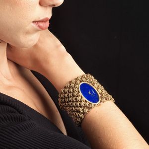 GRANDE BRACCIALE AD AMPIA FASCIA CON OROLOGIO  - Asta Gioielli - Associazione Nazionale - Case d'Asta italiane