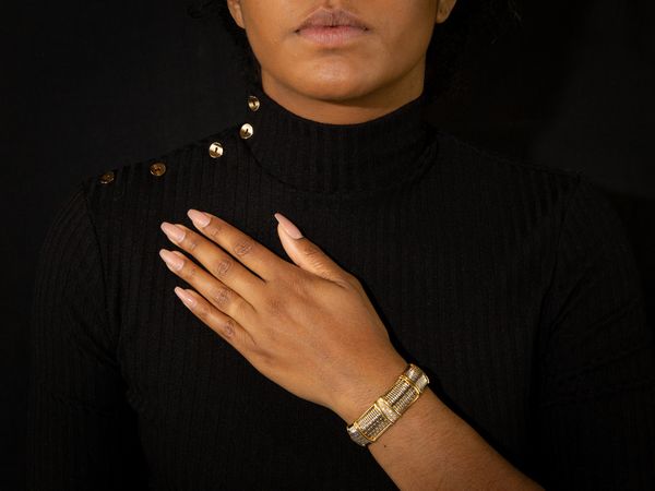 Bracciale rigido in oro giallo, acciaio e diamanti  - Asta Gioielli e Orologi - Associazione Nazionale - Case d'Asta italiane