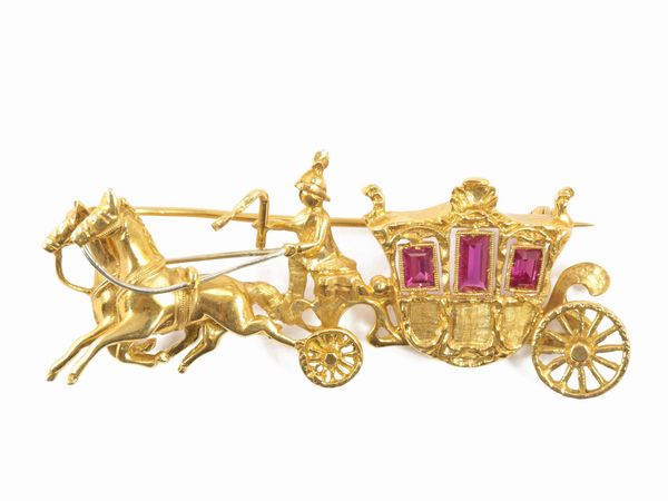 Spilla in oro giallo con rubini sintetici  - Asta Gioielli e Orologi - Associazione Nazionale - Case d'Asta italiane