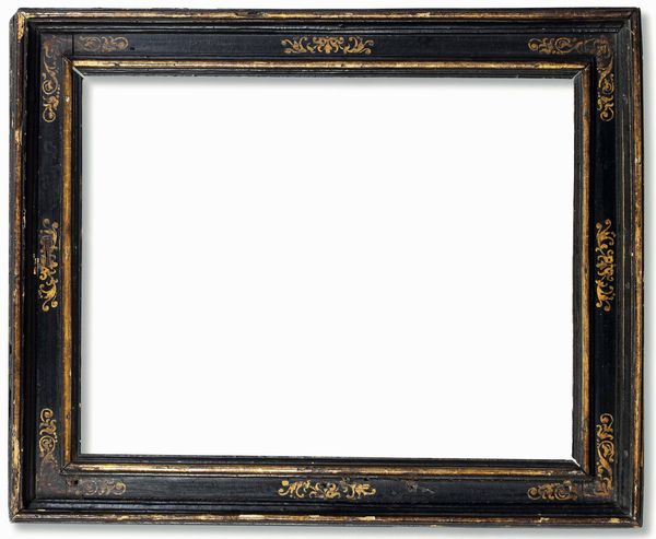 Cornice a cassetta in legno ebanizzato con decori dorati. Italia centrale XVII secolo  - Asta Cornici antiche - Associazione Nazionale - Case d'Asta italiane