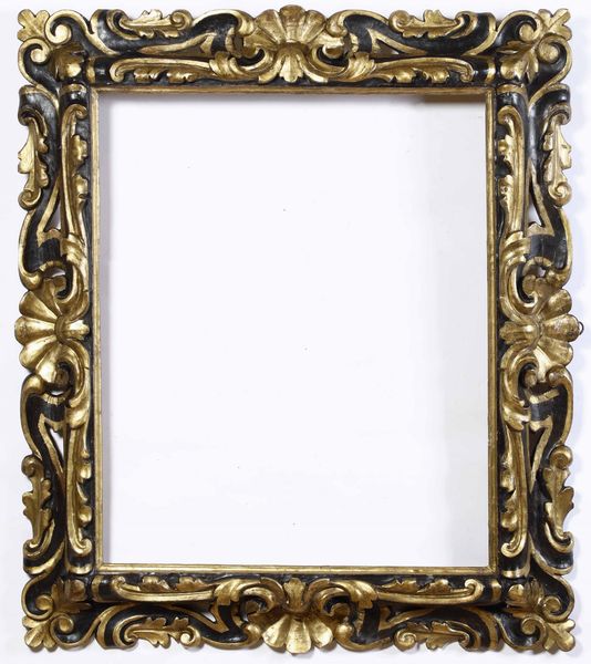 Cornice ''palatina'' in legno intagliato, dorato ed ebanizzato. Toscana XVII secolo  - Asta Cornici antiche - Associazione Nazionale - Case d'Asta italiane