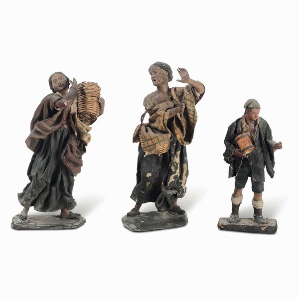 Tre figure da presepe in cartapesta raffiguranti mercanti. XIX-XX secolo  - Asta Dimore italiane - Associazione Nazionale - Case d'Asta italiane