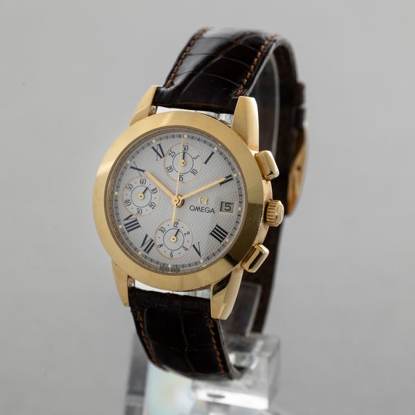 OMEGA - Louis Brandt cronografo tre contatori verticali con datario, cassa in oro giallo 18k, quadrante bianco guilloch� con numeri Romani accompagnato da scatola  - Asta Orologio da polso e da tasca  - Associazione Nazionale - Case d'Asta italiane