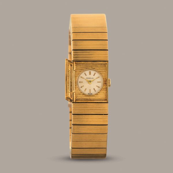 GUBELIN - Montre a Secret in oro giallo 18k con apertura laterale a pressione nascosta, quadrante argent� con indici applicati movimento a carica manuale  - Asta Orologio da polso e da tasca  - Associazione Nazionale - Case d'Asta italiane