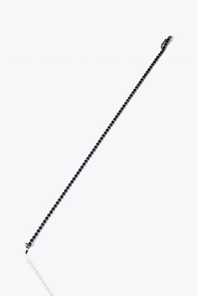 BRACCIALE : Peso gr 3 7 Lunghezza cm 18 in oro bianco  modello tennis  con spinelli neri taglio rotondo  - Asta Gioielli - Associazione Nazionale - Case d'Asta italiane