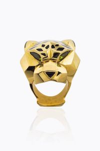 CARTIER - Peso gr 54 Misura 14 (54) Grande anello in oro giallo  firmata Cartier modello Panthre; due peridoti taglio navette  [..]