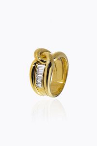 ANELLO - Peso gr 16 Misura 16 (56) a fascia  in oro giallo  sommit a nodo  con fila di diamanti taglio baguette per totali  [..]