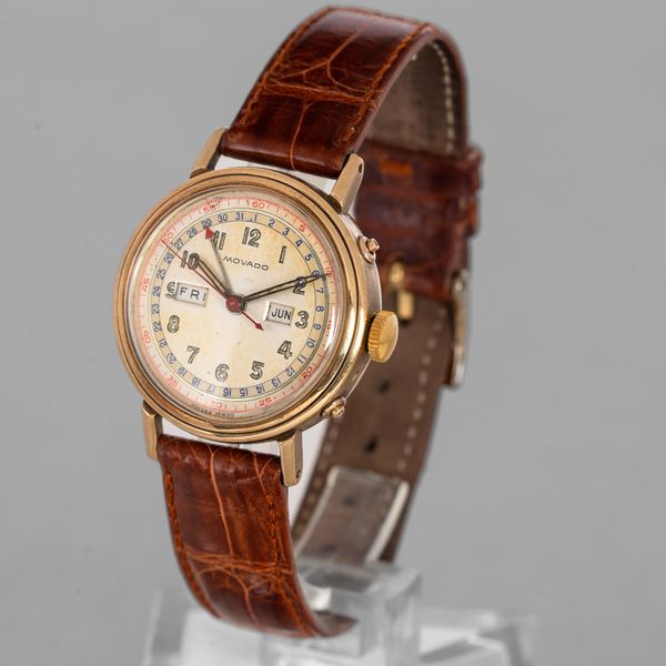 MOVADO - Orologio da polso in oro 14k, carica manuale con triplo calendario con quadrante fan� e fondello a vite  - Asta Orologi da Polso e da Tasca - Associazione Nazionale - Case d'Asta italiane