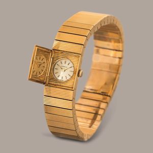 GUBELIN - Montre a Secret in oro giallo 18k con apertura laterale a pressione nascosta, quadrante argent� con indici applicati movimento a carica manuale  - Asta Orologi da Polso e da Tasca - Associazione Nazionale - Case d'Asta italiane
