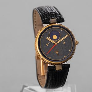 GERALD GENTA - Gefica calendario completo con fasi lunari in oro 18k, quadrante ardesia, anse Vendome, con scatola originale  - Asta Orologi da Polso e da Tasca - Associazione Nazionale - Case d'Asta italiane